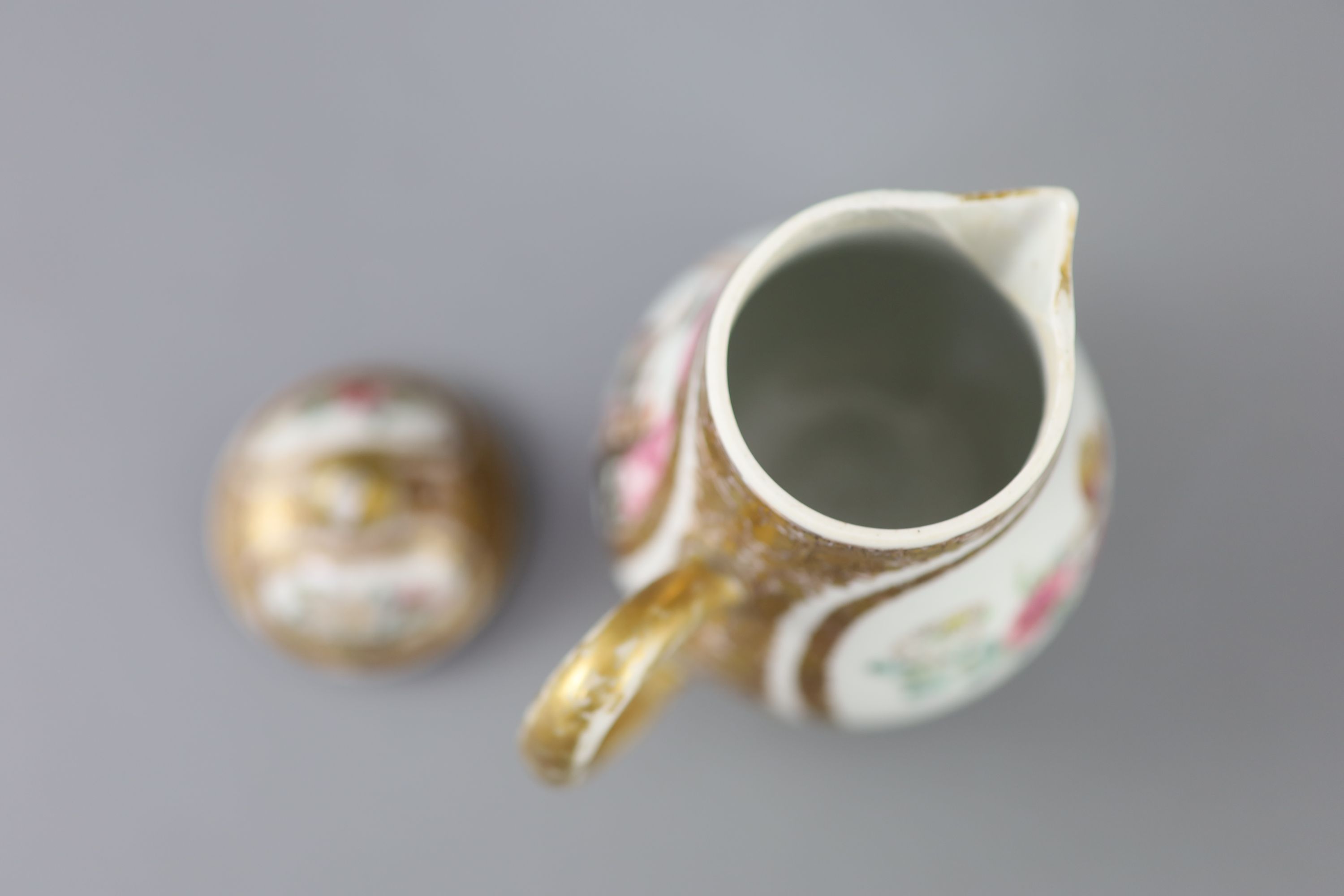 A Chinese famille rose covered jug, Yongzheng period (1723-35), 11.3cm high